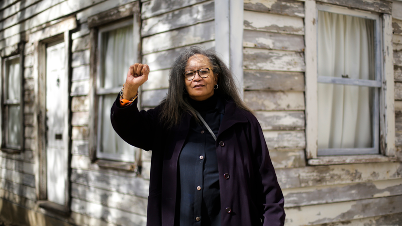 In this April 6, 2017, photo Rhea McCauley, a niece of Rosa Parks, poses in front of the rebuilt house of Rosa Parks in Berlin. McCauley donated the former Detroit house of Parks to American artist Ryan Mendoza, who took apart the Michigan house Parks once lived in and rebuilt it in the German capital to raise awareness about the late civil rights activist and her legacy. (Markus Schreiber/AP Images)